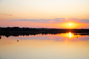 Plakat orange sunset on a blue lake