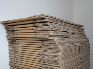 stacked corrugated transport cartons in a row