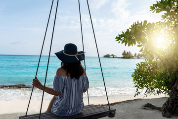Attractive young girl relaxing and enjoying in holiday. Summer vacation concept