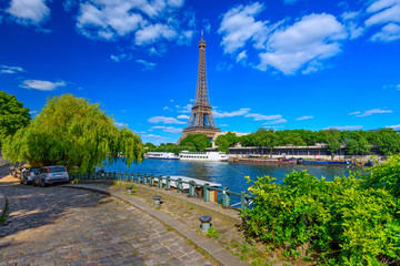 Paris Eiffel Tower and river Seine in Paris, France. Eiffel Tower is one of the most iconic...