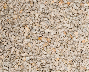 Vue gros plan d'une texture de pierre et gravier gris clair et crème