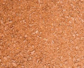 Vue gros plan d'une texture de pierre, gravier et sable fin orange et ocre