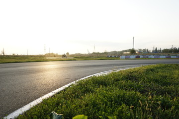 road, asphalt, dividing lines, race track, cone, wheels, tires, green chair, green chair on the...