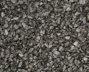 Vue gros plan d'une texture de pierre et gravier gris foncé