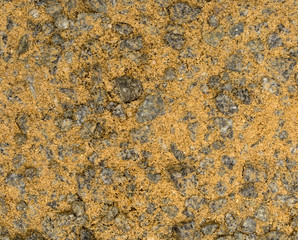 Vue gros plan d'une texture de pierre, gravier et sable fin orange et gris