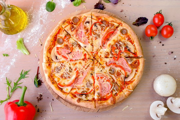 Bacon, mushroom and cheese pizza on wooden board. Close-up top view