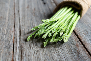 fresh asparagus on wooden background