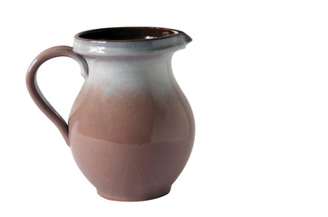 Brown glossy jug with handle isolated on white background.