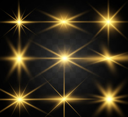 Set of gold bright beautiful stars. Light effect Bright Star. Beautiful light for illustration. Christmas star. White sparks sparkle with a special light. Vector sparkles on transparent background