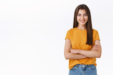 Determined good-looking young woman prepare halloween party, cross hands over chest with confident,...
