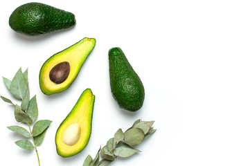 Ripe fresh avocado, eucalyptus twigs isolated on white background with shadow top view Flat lay copy space. Fruits Healthy food concept, diet, healthy lifestyle, organic avocado