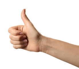 Woman showing thumb up gesture on white background, closeup
