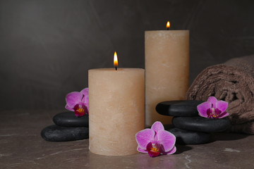 Obraz na płótnie Canvas Composition with candles and spa stones on marble table