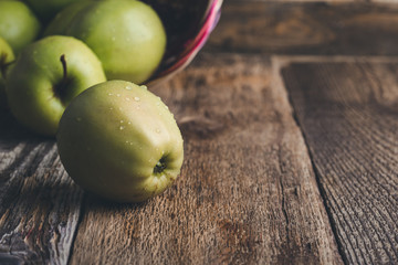 Fresh ripe  green apples In wicker  basket