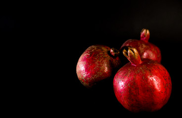 pomegranate isolated on black background.