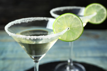 Glasses of Lime Drop Martini cocktail on table, closeup