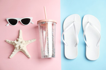Flat lay composition with beach objects on color background