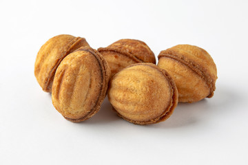 Tasty crunchy cookie: oatmeal, shortbread, chocolate, nutty, honey. Close-up isolated on a white background