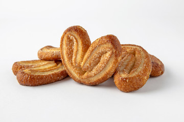 Tasty crunchy cookie: oatmeal, shortbread, chocolate, nutty, honey. Close-up isolated on a white background