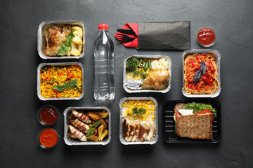 Lunchboxes on grey table, flat lay. Healthy food delivery