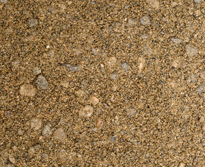 Vue gros plan d'une texture de pierre, gravier et sable fin orange et marron