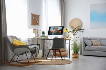 Comfortable workplace with modern computer on desk. Home office