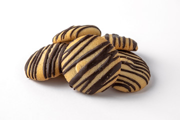 Tasty crunchy cookie: oatmeal, shortbread, chocolate, nutty, honey. Close-up isolated on a white background