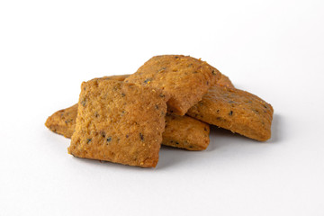 Tasty crunchy salty and spicy cookies: oatmeal, shortbread. Beer snack. Close-up isolated on a white background
