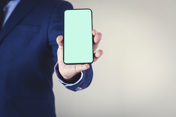 man hand holding smart phone