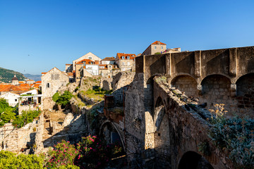 Fototapeta na wymiar The old walls and the houses of Dubrovnik on daylight