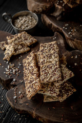 Snack for beer, alcohol. Crispy and crumbly delicious Salty and spicy cookies with seeds, chili peppers, spices and salt. Stylish still life for poster.