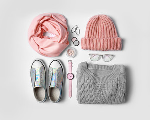 Stylish female autumn outfit and accessories on white background, flat lay. Trendy warm clothes