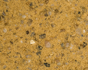 Vue gros plan d'une texture de pierre, gravier et sable fin orange et marron
