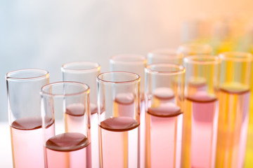 Closeup view of many test tubes with liquid, color tone effect