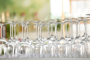 Empty glasses on table against blurred background