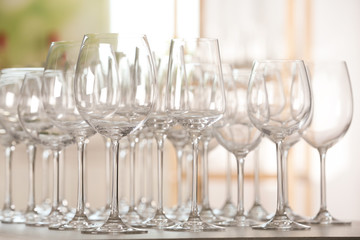 Empty glasses on table against blurred background