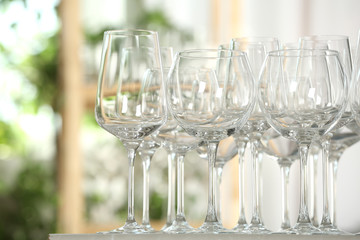 Empty glasses on table against blurred background