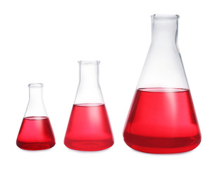 Conical flasks with red liquid on white background. Laboratory glassware