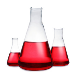 Conical flasks with red liquid on white background. Laboratory glassware