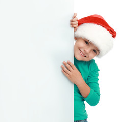 Cute little child wearing Santa hat on white background. Christmas holiday