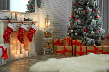 Beautiful decorated Christmas tree in living room interior