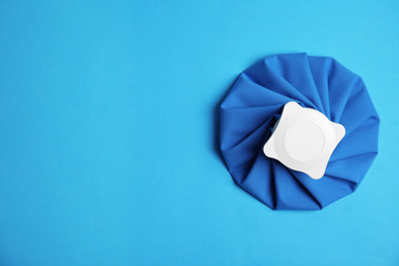 Ice pack on blue background, top view. Space for text