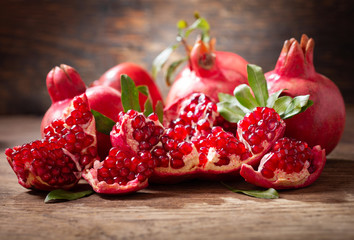 fresh ripe pomegranates with leaves