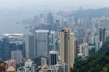 View on Skyscraper Panorama with Victoria Bay, Transportation Ships, Harbour and Kowloon taken from Hongkong Island Peak. Hong Kong, China