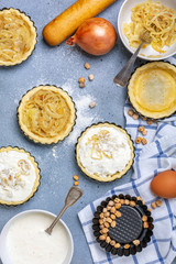 Cooking onion mini pies.