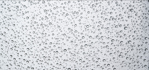 Water drops on transparent glass surface