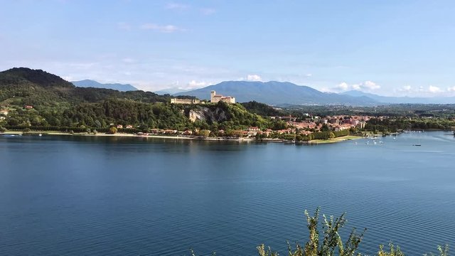 View of Rocca Borromea at Angera, is a Borromeo Castle that stands on the lakeside Maggiore hilltop in province of Varese, Italy