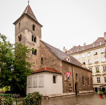 The medieval Ruprechtskirche (St. Rupert's Church) with old tree on the small yard is one of the oldest churches in Vienna, located on Ruprechtsplatz square, Austria