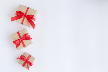brown gift box with red ribbon on white background top view for christmas or celebrate