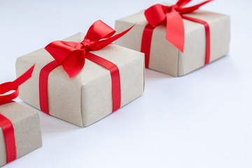 brown gift box with red ribbon on white background top view for christmas or celebrate